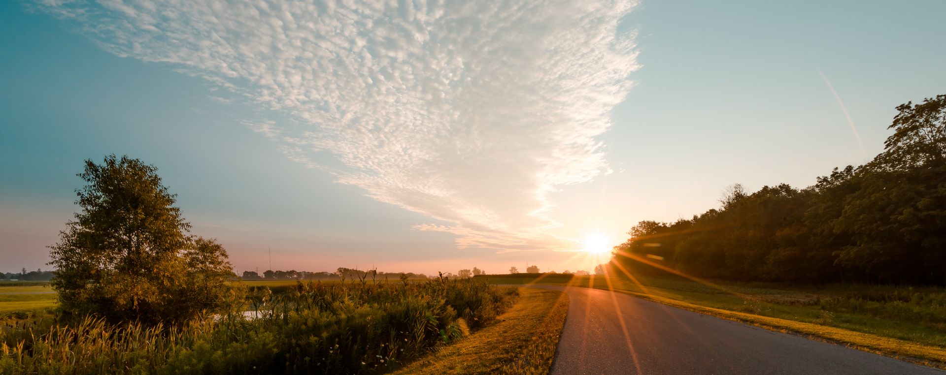 An open road into the sunrise